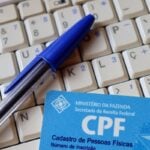 CPF, teclado e caneta azul: consulta de precatório e RPV pelo CPF